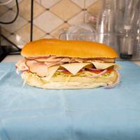 Hero Turkey Sandwich · Includes cheese, lettuce and tomato.