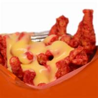 39. Hot Cheetos with Cheese · 2 oz bag served with nacho cheese sauce.