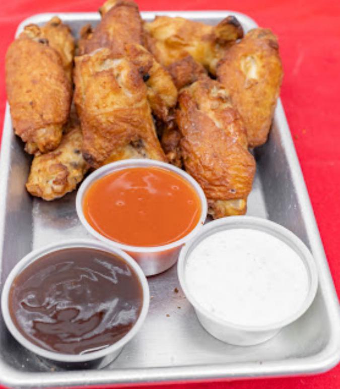 Chicken Wings · Deep-fried chicken wings with your choice of sauce