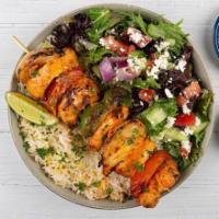 Chicken Kabob Plate · Tender chargroiled cubes of chicken served with basmati rice, side salad, fresh pita, and a ...