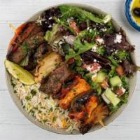 Chicken & Beef Shish Kabob Plate · Mixed chicken and beef kabob served with basmati rice, side salad, fresh pita, and a side of...