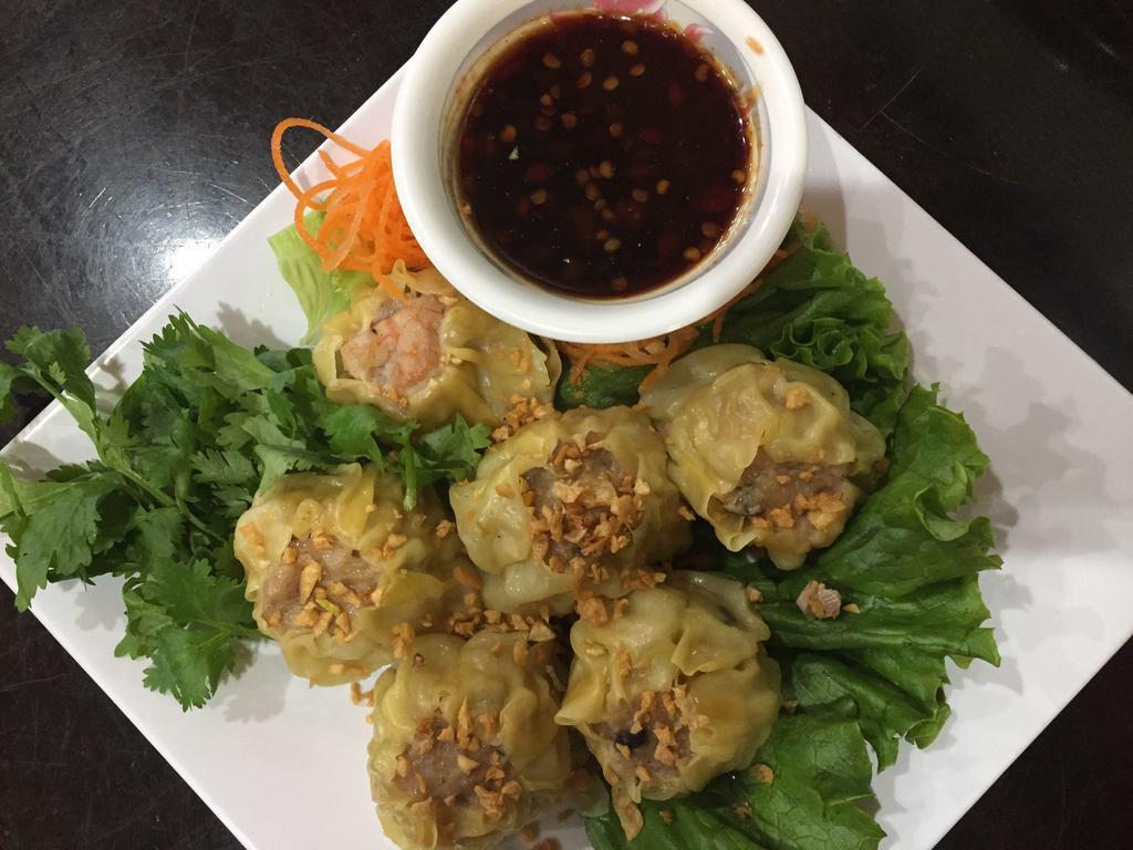 Steamed Dumpling 6 pcs ขนมจีบ · Marinated chicken, shrimp, Thai herb with special soy dipping sauce