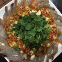 A16. Raw Shrimp Spicy Fish Sauce กุ้งแช่น้ำปลา · Topped with garlic, chili and lime juice. Spicy.
