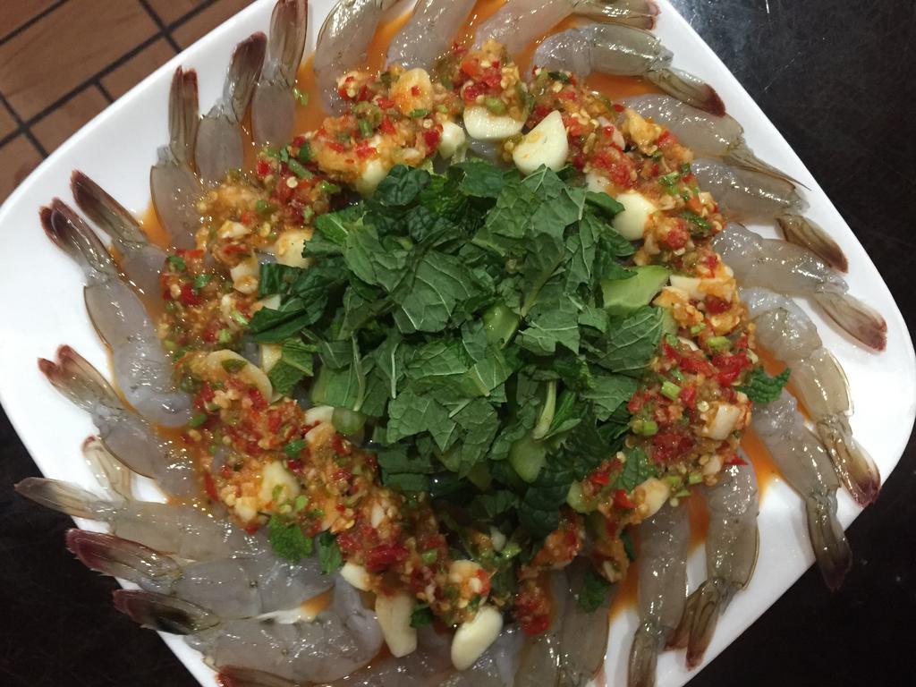 A16. Raw Shrimp Spicy Fish Sauce กุ้งแช่น้ำปลา · Topped with garlic, chili and lime juice. Spicy.