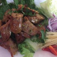 A21. Northern Thai Sausage ไส้อั่ว · Grilled marinated pork and served with vegetable.