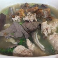 S9. Pork Blood Clear Soup ต้มเลือดหมู · With pork, liver, intestine and stomach.