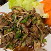 A29. Num Tok Beef น้ำตกเนื้อ · With onion, chili, lime juice and roasted rice. Spicy.