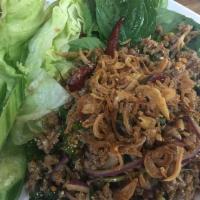 A31. Larb Duck ลาบเป็ด · With chili, lime juice and roasted rice. Spicy.