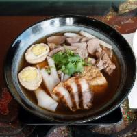 N1. Guay Jub ก๋วยจั๋บ · Thai noodle dark soup. With crispy pork, heart, intestine, liver and boiled egg.