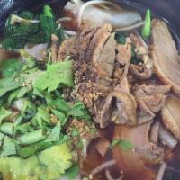 N2. Duck Noodle Soup ก๋วยเตี๋ยวเป็ด · Dark soup with bean sprout and scallion.