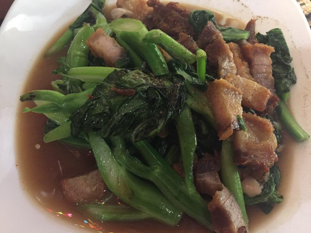 E7. Crispy Pork and Chinese Broccoli ผัดคะน้าหมูกรอบ · Sauteed with oyster sauce with Crispy pork. Spicy.