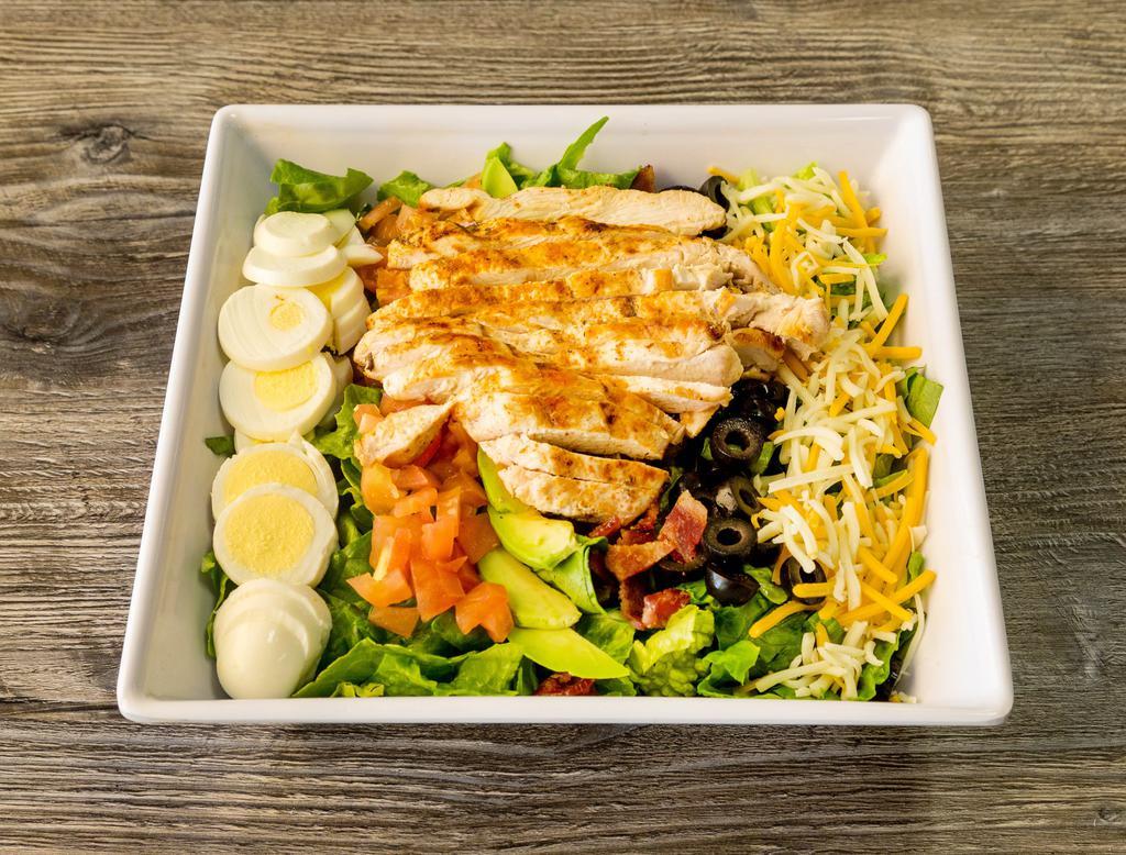Cobb Salad · Romaine with grilled chicken, bacon, avocado, egg, cheese, tomato and black olive.