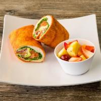 Supreme Wrap · Turkey, bacon, avocado, Swiss, lettuce, tomato and mayo wrapped in wheat tortilla. Served wi...