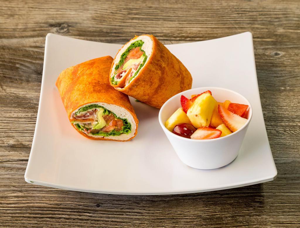 Supreme Wrap · Turkey, bacon, avocado, Swiss, lettuce, tomato and mayo wrapped in wheat tortilla. Served with choice of side.