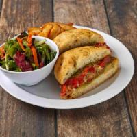 Mediterranean Sandwich · Grilled eggplant, roasted red peppers, tomatoes, pesto and provolone on focaccia. Served wit...