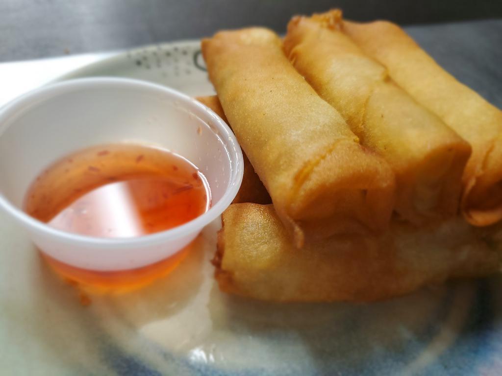 Spring Roll ·  6 pieces of Spring roll wrapper, glass noodle, mushroom, carrot celery, and cabbage, served with plum sauce.
