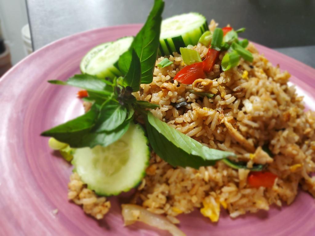Basil Fried Rice · Fried rice with your choice of protein, Thai basil, egg, onion, green onion, chili, and garlic.