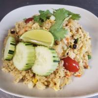 Pineapple Fried Rice · Fried rice with your choice of protein, pineapple, egg, tomato, raisin, green onion, cashew ...