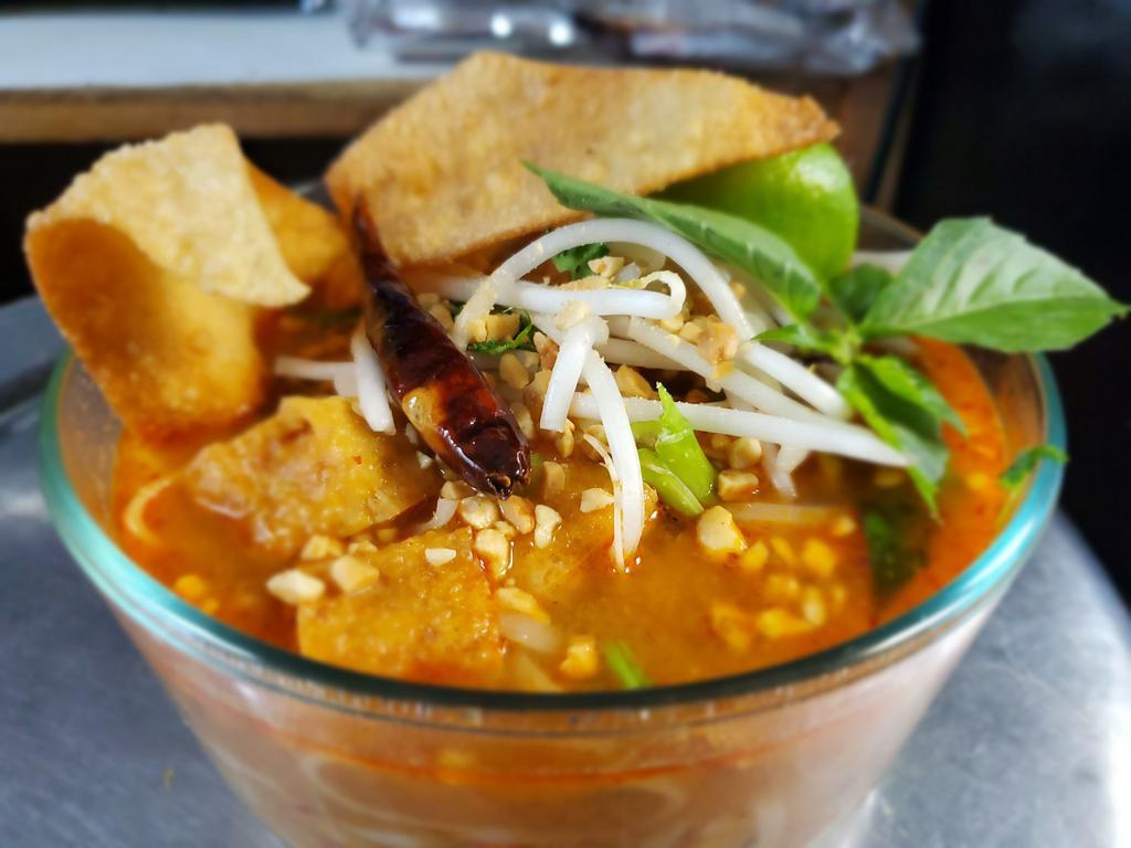 Tom Yum Noodle Soup · Rice noodles, green onion, Thai basil, bean sprout, cracked peanut, and fried wonton.