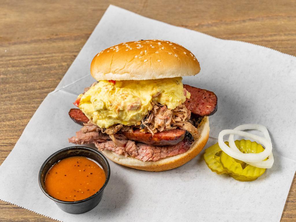 Big Daddy Sandwich · Combination of pulled pork, sausage and brisket topped with potato salad.