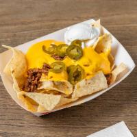 Loaded Nachos · Your choice of pulled pork or chopped beef smothered in cheese, jalapenos and sour cream.