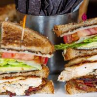 Grilled Chicken Avocado Club · Organic grilled chicken, avocado, applewood bacon, tomato, Gouda and mayo on seven-grain bre...