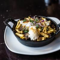 Braised Short Rib and Cavatelli · Prime short rib baked with mushrooms, pearl onions and whipped ricotta.