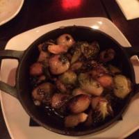 Charred Brussel Sprouts · Bacon, balsamic and pearl onions.