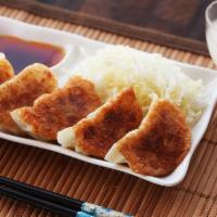 6 Piece Gyoza · pork & chicken gyoza, 6 pieces. Pan fried or steamed. Comes with our famous house special Gy...