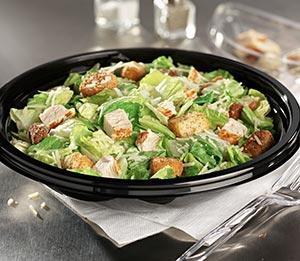 Chicken Caesar Salad · Mixed greens with grilled chicken, shredded Parmesan and Asiago cheeses with whole grape tomatoes, croutons and Caesar dressing. Salad dressing is served on the side.