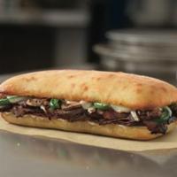 Philly Cheesesteak Sandwich · Tender slices of steak, American and provolone cheese, fresh onions, fresh green peppers, an...