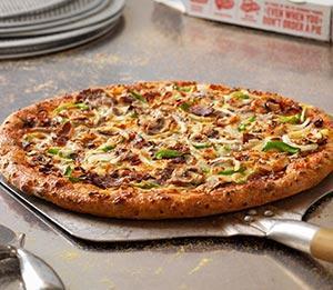 Philly Cheesesteak Pizza · Tender slices of steak, onions, green peppers and mushrooms with provolone and American cheeses on a provolone crust.  