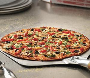 Pacific Veggie Pizza · Made with roasted red peppers, spinach, onions, mushrooms, tomatoes and black olives with feta, mozzarella and provolone cheese on a cheesy Parmesan crust. Vegetarian.