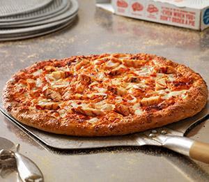 Buffalo Chicken Pizza · Grilled chicken breast, fresh onions, provolone, American cheese, cheddar cheese made with 100% real mozzarella and drizzled with a kicker hot sauce.