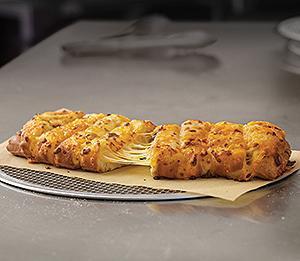 Stuffed Cheesy Bread · 8 pieces. Oven-baked bread sticks stuffed with cheese and covered in a blend of cheese made with mozzarella and cheddar. Seasoned with a sprinkling of garlic, parsley and Romano cheese.