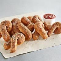 Parmesan Bread Twists · Handmade from fresh buttery tasting dough and baked to a perfect golden brown, a savory blen...