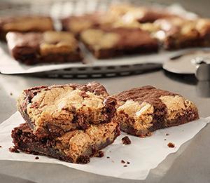 Marble Cookie Browni · Satisfy your sweet tooth! Taste the decadent blend of gooey milk chocolate chunk cookie and delicious fudge brownie. Oven-baked to perfection and cut into 9 pieces - this dessert is perfect to share with the whole group.