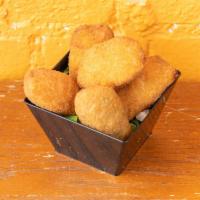 Jalapeno Poppers · 6pcs Fried and breaded jalapenos with cheese filling.