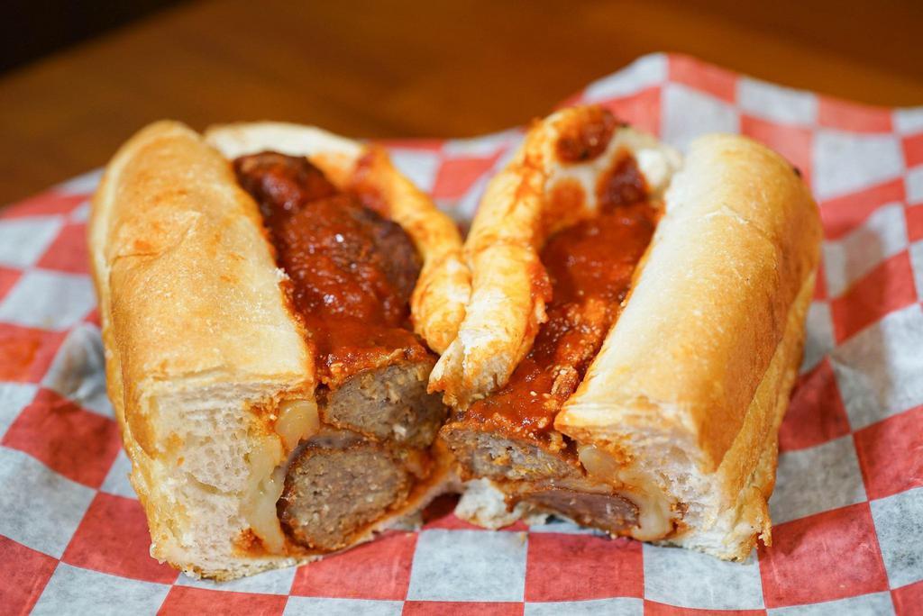 Full Meatball Parm. Hoagie · Delicious homemade Italian meatballs topped with our homemade marinara sauce, shredded parmesan and mozzarella cheese served on a toasted amoroso hoagie.