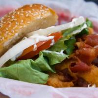 Chicken Bacon Ranch Wich’ · Crispy fried chicken basted with ranch dressing topped with bacon, lettuce, tomato, raw onio...