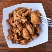 Izzie’s Chicken Bites · Deep fried homemade breaded chicken breast cut into bites. Comes with your choice of bbq or ...