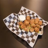 Boudin Chips · Bold boudin slices dusted in flour, fried and finished with cajun spices. Served with butter...