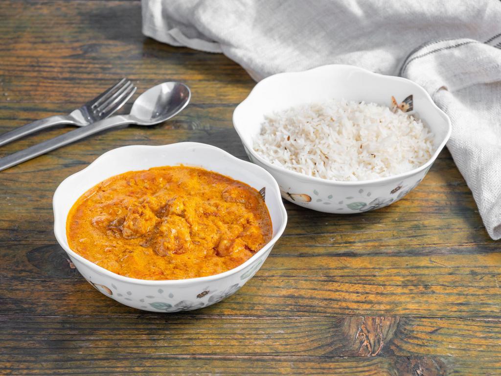 Chicken Tikka Masala · Boneless chicken cooked with tomatoes and spices.