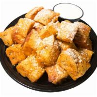 Buffalo Parmesan Yummy Bread Bites · Oven baked bread bites tossed in Buffalo mild sauce, seasonings, and parmesan cheese. Served...