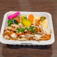Chicken Shawarma Platter · Roasted strips of marinated chicken. Served with rice, salad, fresh pita bread and sauces. E...