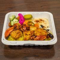 Chicken Shish Taouk Mashawi Platter · Char-grilled marinated chicken breast cubes. Served with rice, salad, fresh pita bread and s...