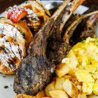 Jerk Lamb Chops ＆ Eggs · Served with two eggs any style, choice of grits or hashbrowns and waffles.