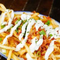 Loaded Fries · French fries topped with cheese sauce, bacon, chives, and sour cream.