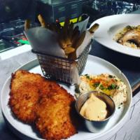 Moms Schnitzel · Thin cut chicken breast in Japanese breadcrumb crust, mashed potato, Montpellier butter and ...