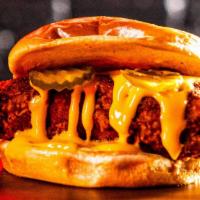 2. Cheese Slider · Chicken tender served in a bun with cheese sauce and pickles.